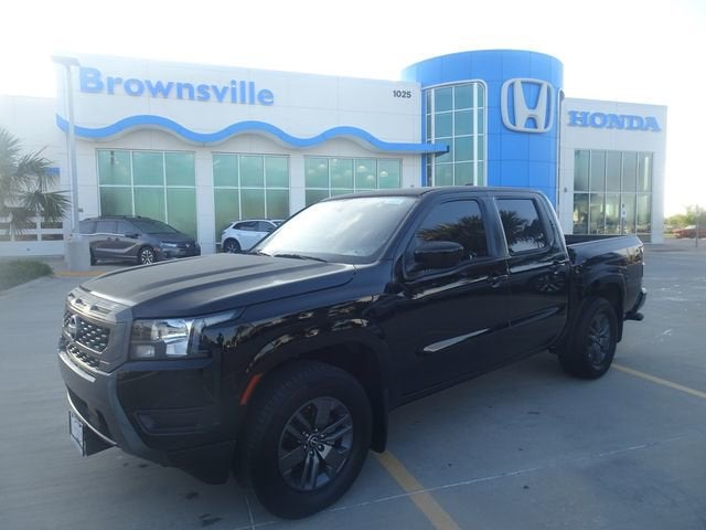 2025 Nissan Frontier SV in Super Black — front three-quarter view