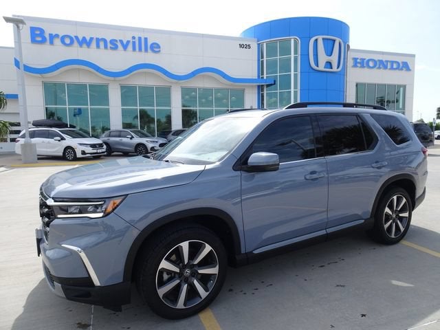 2025 Honda Pilot Touring in Sonic Gray Pearl — front three-quarter view