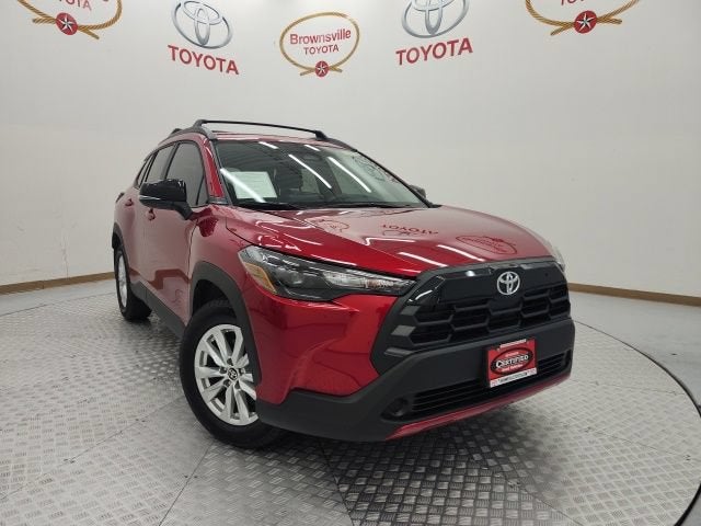 2026 Toyota Corolla Cross LE in Red Crystal — front three-quarter view